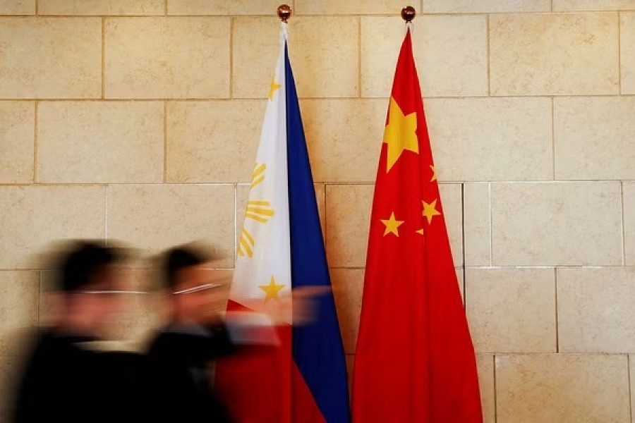 National flags are placed outside a room where Philippine Finance Secretary Carlos Dominguez and China's Commerce Minister Gao Hucheng address reporters after their meeting in Beijing, China, January 23, 2017. REUTERS