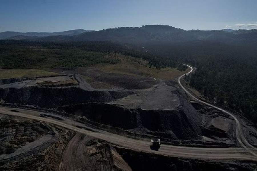 The edge of Glencore's Mount Owen coal mine and adjacent rehabilitated land are pictured in Ravensworth, Australia, Jun 21, 2022. Picture taken June 21, 2022. Picture taken with a drone. REUTERS