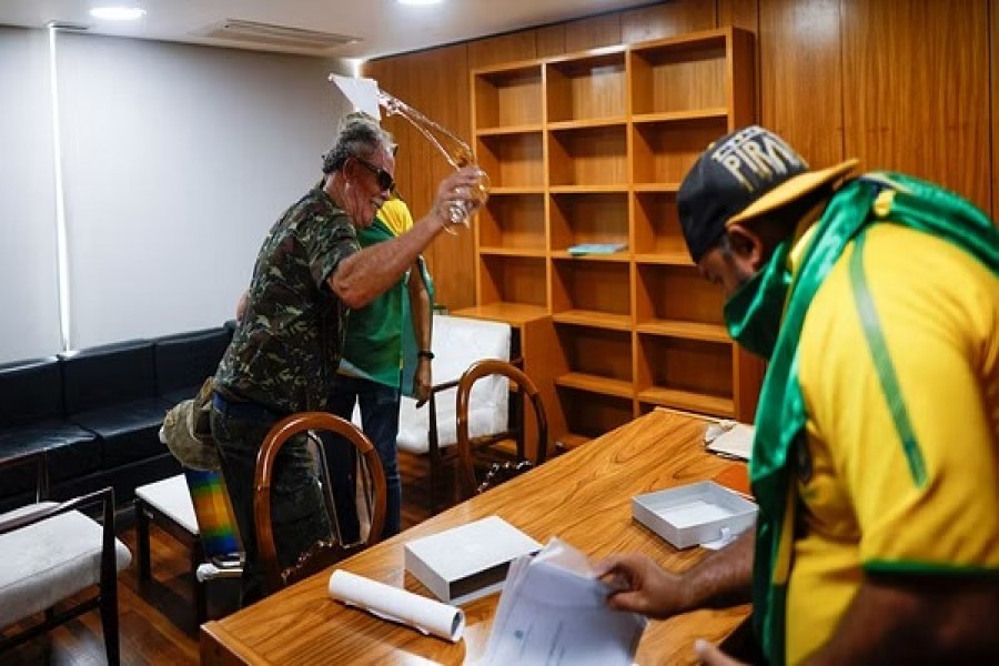 Supporters of Brazil's former President Jair Bolsonaro vandalize a room in Planalto Palace during a demonstration against President Luiz Inacio Lula da Silva, in Brasilia, Brazil, December 8, 2023. Reuters