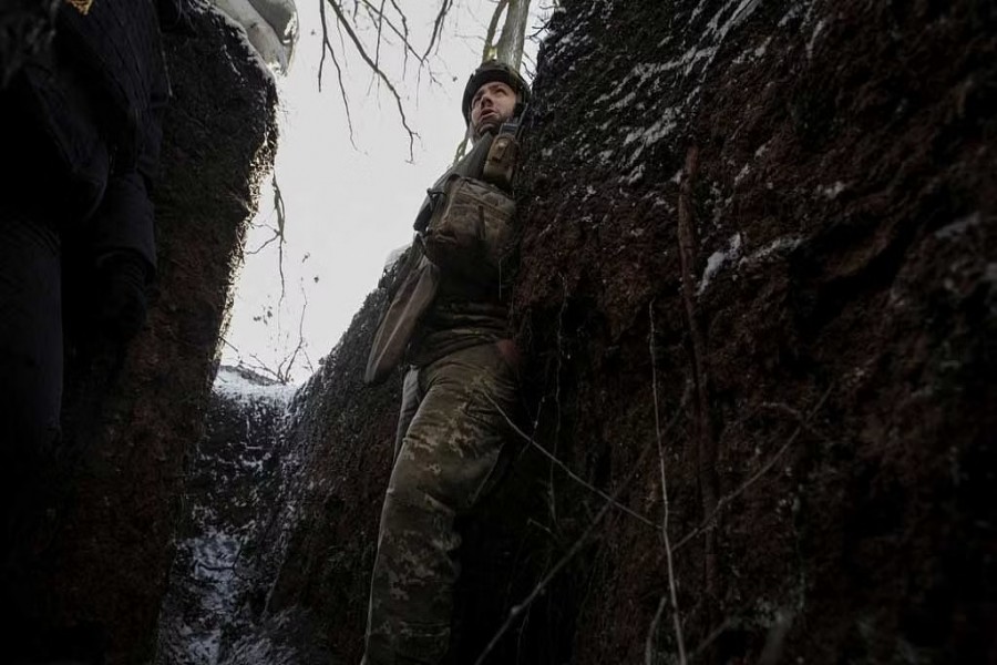 A Ukrainian serviceman is seen in a trench at a frontline, amid Russia's attack on Ukraine, in Donetsk region, Ukraine January 7, 2023. REUTERS/Anna Kudriavtseva