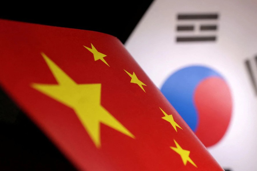 Printed Chinese and South Korean flags are seen in this illustration, July 21, 2022. REUTERS/Dado Ruvic/Illustration/Files