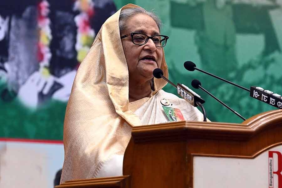 Prime Minister Sheikh Hasina addressing a discussion marking the historic Homecoming Day of Bangabandhu organised by the Awami League at Bangabandhu International Conference Centre (BICC) in Dhaka on Tuesday -PID Photo