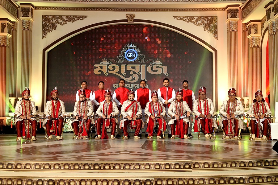 The top ten dealers with the Board of Directors of GPH ispat Limited. From left to right - Director Md. Abdul Ahad, Additional Managing Director Md. Almas Shimul, Chairman Md. Alamgir Kabir, Managing Director Mohammed Jahangir Alam, Director Md. Ashrafuzzaman, Director Md. Azizul Hoque Raju, Seated - Top ten dealers of GPH ispat Limited.