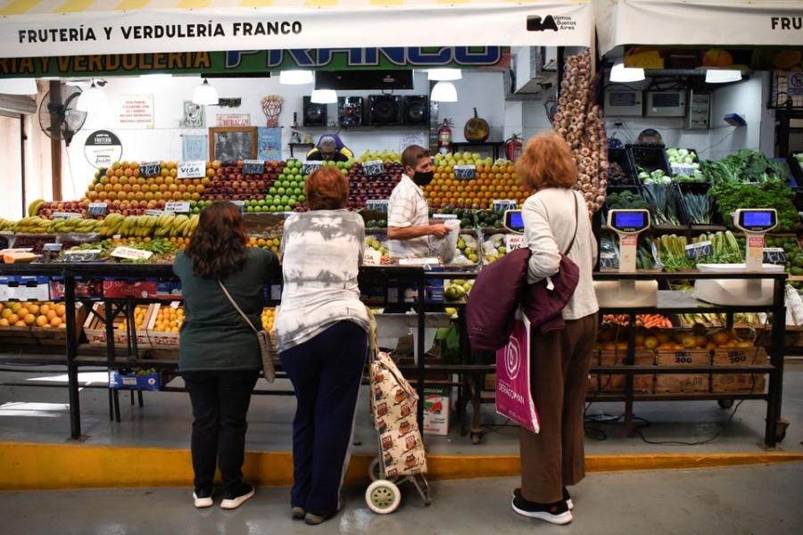 Customers line up to buy produce in a market as inflation in Argentina hits its highest level in years, causing food prices to spiral, in Buenos Aires, Argentina on April 12, 2022 — Reuters/Files