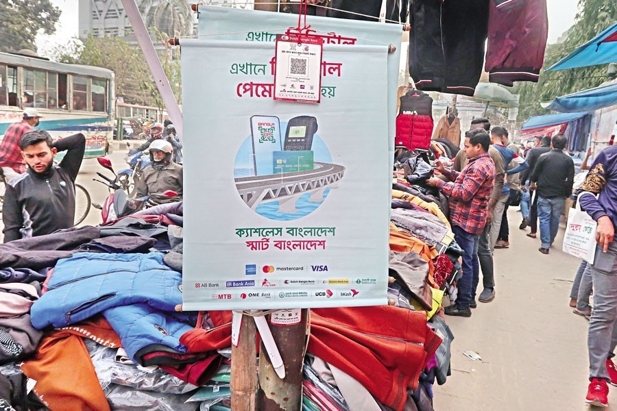 A roadside shop in Dhaka's Motijheel area puts up a sign that says the shop accepts digital payment from customers. Bangladesh Bank started an initiative styled 'Cashless Bangladesh' on Wednesday, in order to popularise an interoperable QR code across the capital. The campaign, which will run between January 18 and February 21, will bring millions of small businesses, including street vendors, under the digital transaction system. — FE photo by Shafiqul Alam