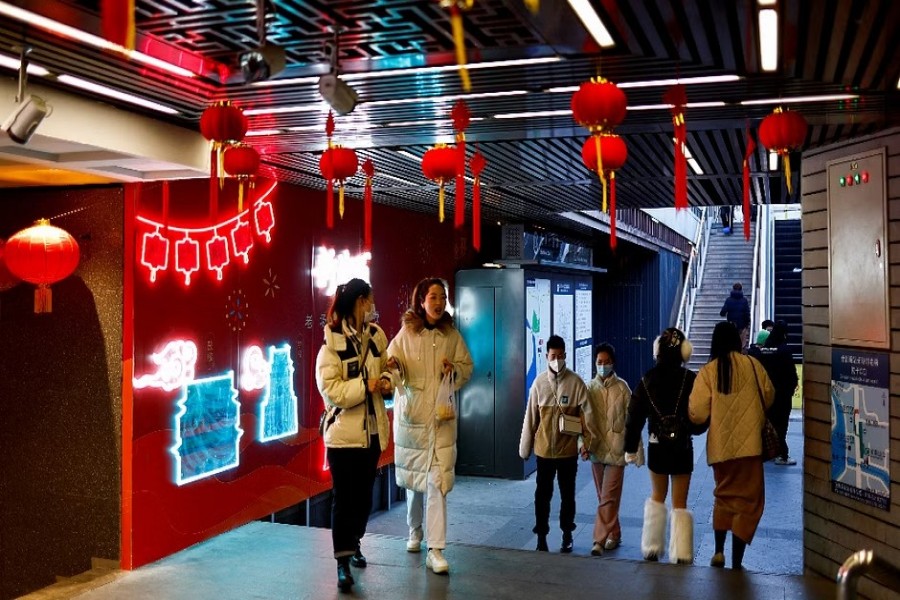 People walk past an underground area decorated with lanterns for Chinese Lunar New Year, amid the coronavirus disease (COVID-19) outbreak in Beijing, China January 6, 2023. REUTERS