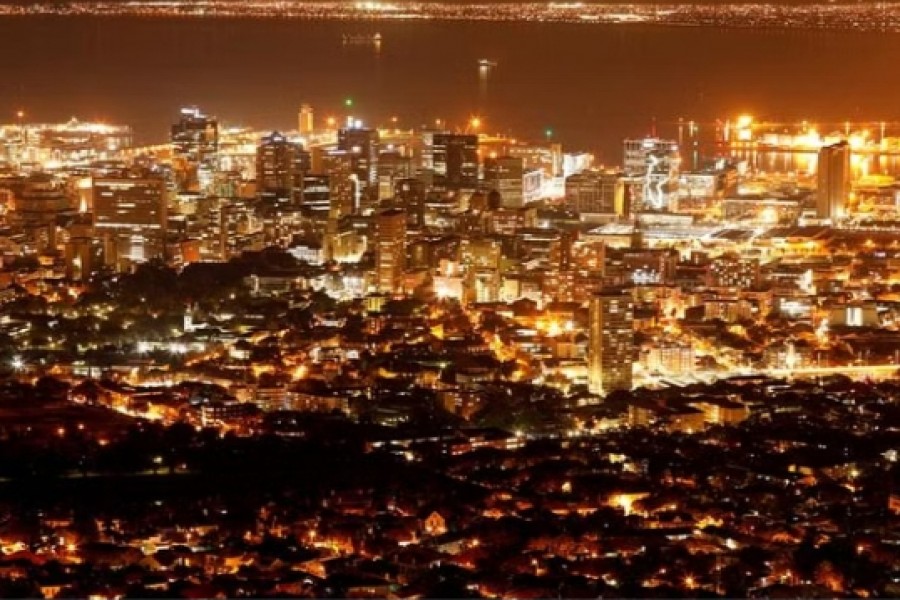 FILE PHOTO: Electricity lights up the central business district of Cape Town, South Africa, Jun 18, 2019. REUTERS