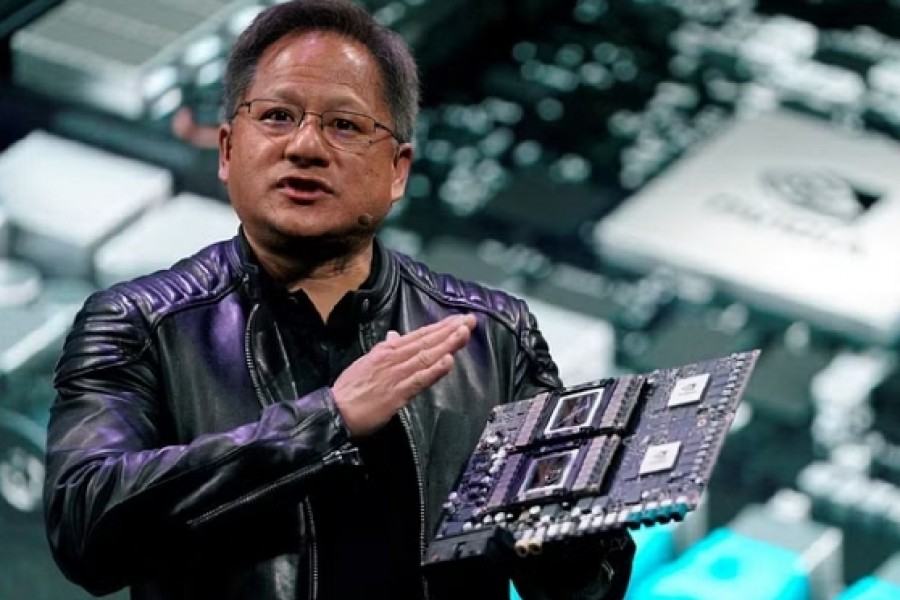Jensen Huang, CEO of Nvidia, shows the Drive Pegasus robotaxi AI computer at his keynote address at CES in Las Vegas, Nevada, US, Jan 7, 2018. REUTERS
