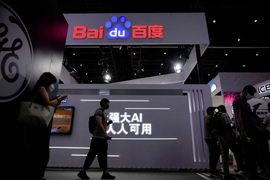 People stand by a sign of Baidu during World Artificial Intelligence Conference, following the coronavirus disease (Covid-19) outbreak, in Shanghai, China on September 1, 2022 — Reuters/Files