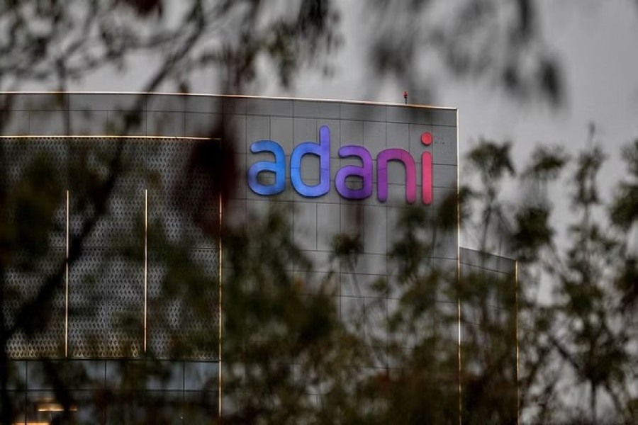 The logo of the Adani Group is seen on the facade of its Corporate House on the outskirts of Ahmedabad, India, Jan 27, 2023. REUTERS