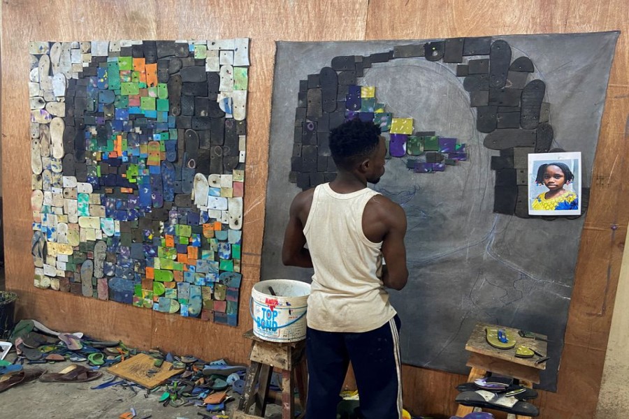 Nigerian artist Eugene Komboye creates artworks using discarded plastic flip-flop sandals in his studio in Abeokuta, Ogun state, Nigeria, January 21, 2023. REUTERS/Seun Sanni