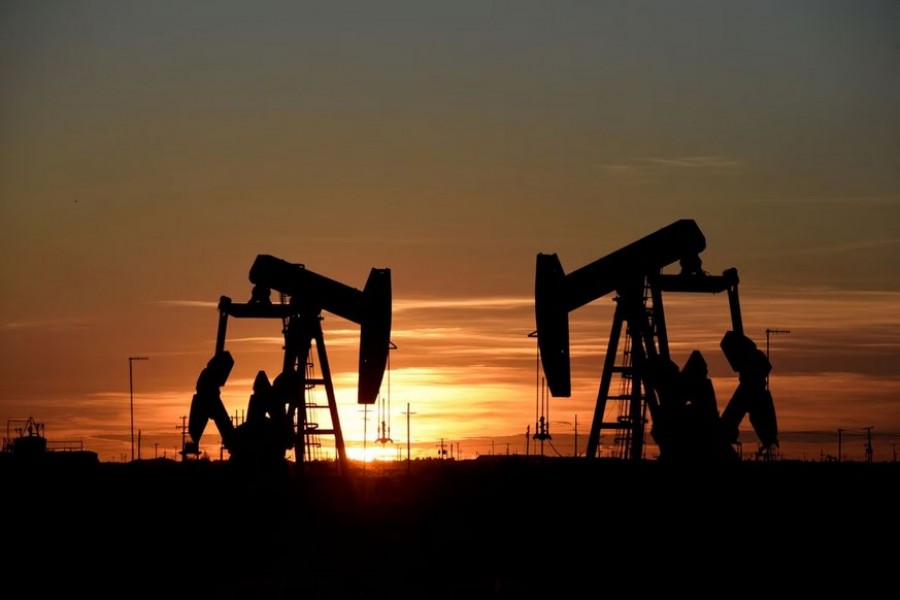 Pump jacks operate at sunset in an oil field in Midland, Texas U.S. August 22, 2018. REUTERS/Nick Oxford/File Photo