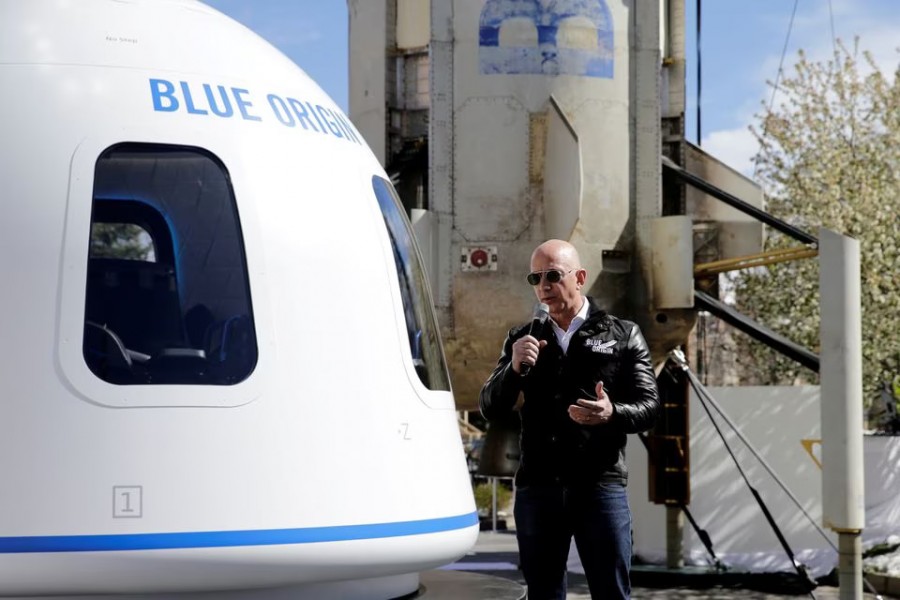 Amazon and Blue Origin founder Jeff Bezos addresses the media about the New Shepard rocket booster and Crew Capsule mockup at the 33rd Space Symposium in Colorado Springs, Colorado, United States on April 5, 2017 — Reuters/Files