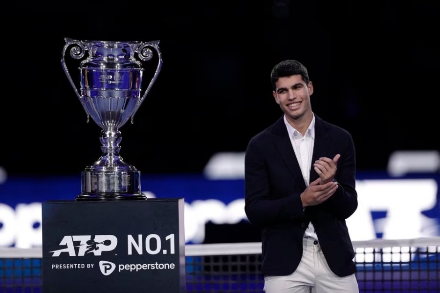 Spain's Carlos Alcaraz poses for a picture with the world number 1 ATP 2022 trophy at Pala Alpitour in Turin, Italy on November 16, 2022 — Reuters/Files