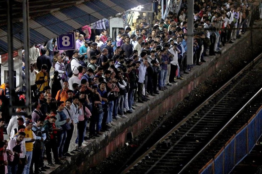 Commuters crowd on a platform as they wait to board suburban trains at a railway station in Mumbai, India on January 20, 2023 — Reuters/Files