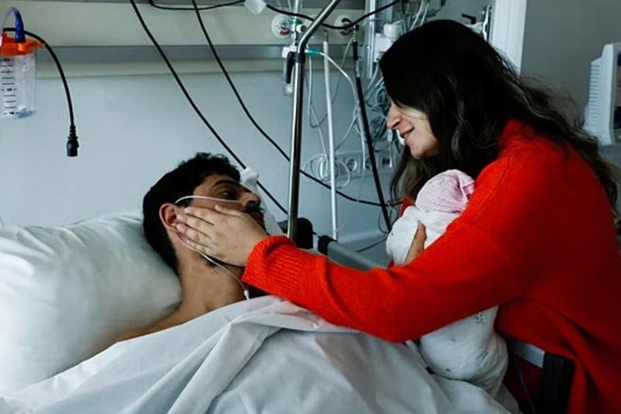 Mustafa Avci, 33, who was stuck under rubble for 261 hours, meets his daughter Almile for the first time and reunites with his wife Bilge, following the deadly earthquake, at a hospital in Mersin, Turkey Feb 17, 2023. Almile was born on the day of the earthquake. REUTERS/Clodagh Kilcoyne