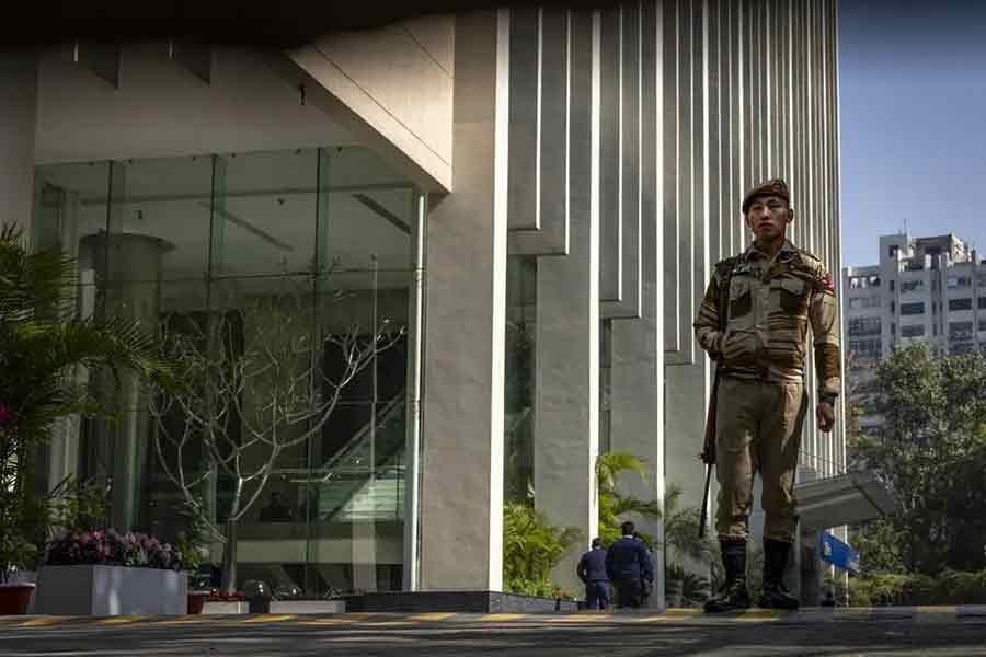 An armed security person performing his duty at the gate of a building housing BBC office in New Delhi on Wednesday –AP file photo