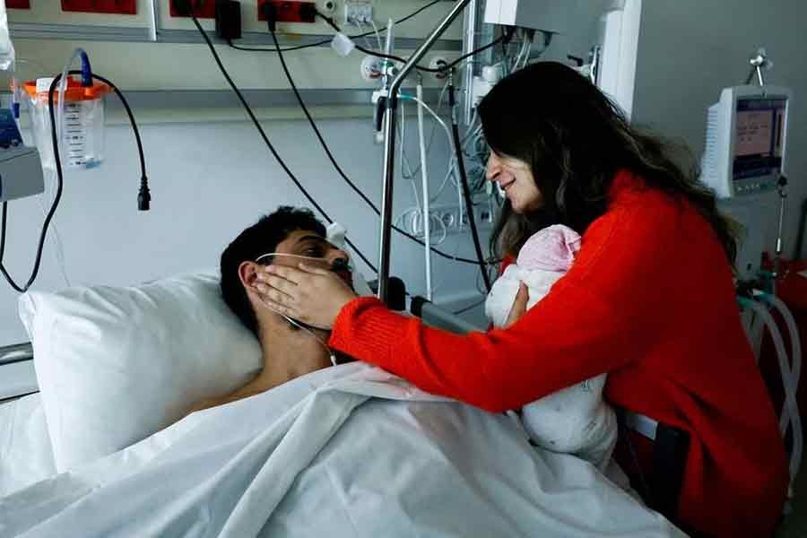 Mustafa Avci, 33, who was stuck under rubble for 261 hours, meeting his daughter Almile for the first time and reunites with his wife Bilge, following the deadly earthquake, at a hospital in Turkey on Saturday –Reuters photo