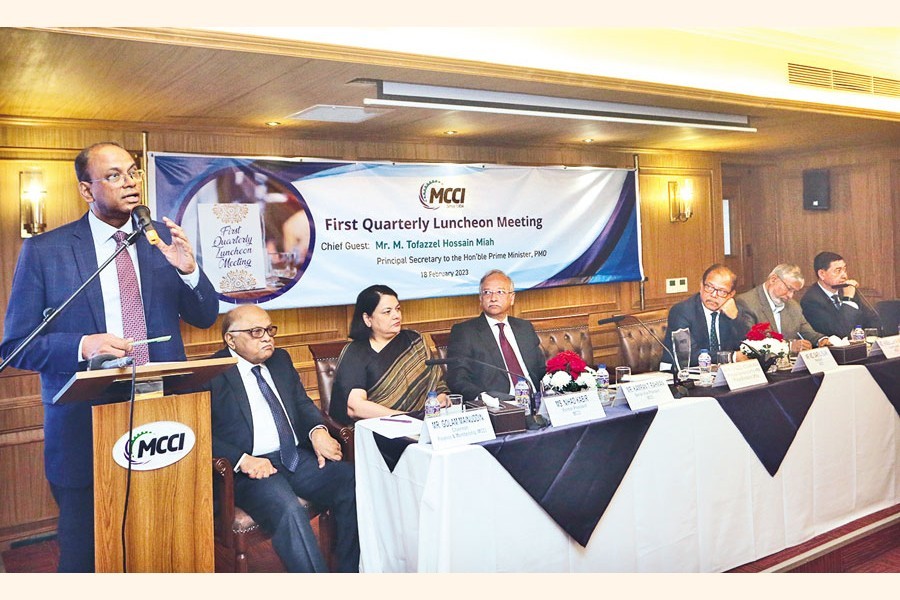 Prime Minister's Principal Secretary M Tofazzel Hossain Miah speaks at the quarterly luncheon meeting of Metropolitan Chamber of Commerce and Industry, Dhaka (MCCI) at its office in the city on Saturday. MCCI President Md Saiful Islam and former MCCI President Nihad Kabir were also present. — FE Photo