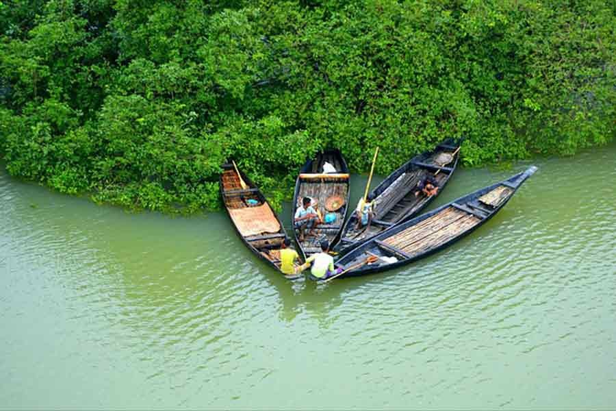 Traditional boat in village is a tourist attraction in Bangladesh. 	—Collected Photo