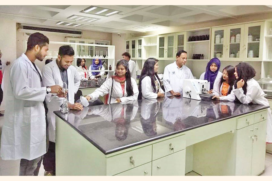 Students with a faculty member at the pharmacy lab at Independent University, Bangladesh