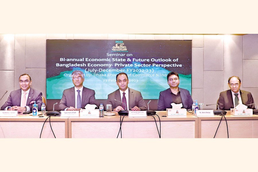DCCI SEMINAR: DCCI President Barrister Md Sameer Sattar (centre) speaks at a seminar on 'Bi-annual economic state and future outlook of Bangladesh economy: Private sector perspective' organised by the DCCI in the capital on Thursday. Tapan Kanti Ghosh, Senior Secretary, Ministry of Commerce; Syed Mahbubur Rahman, Managing Director & CEO, Mutual Trust Bank; and Dr. Selim Raihan, Executive Director, SANEM; also spoke.