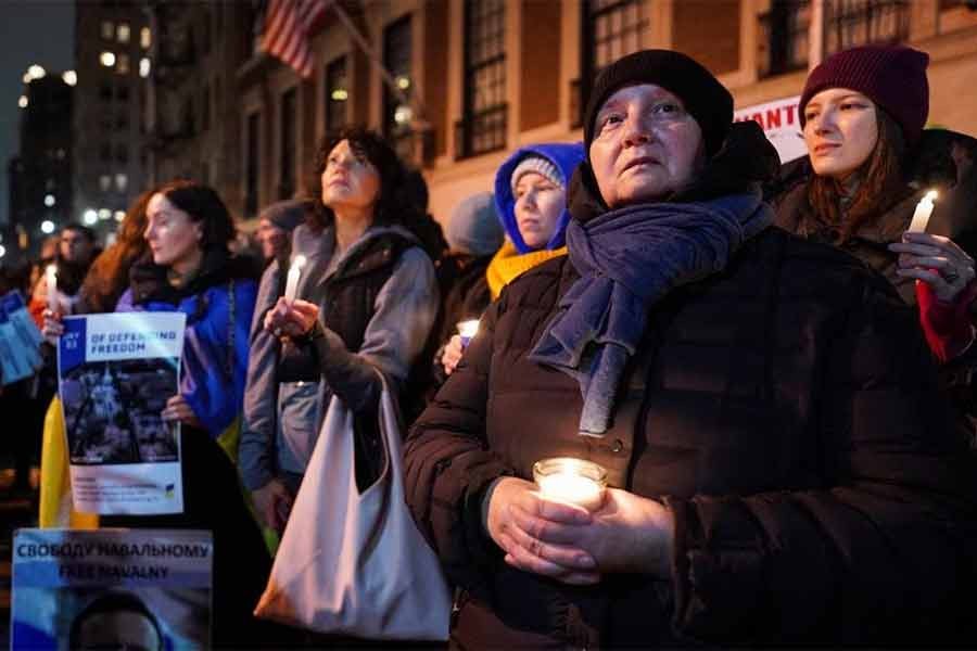People holding a silent candlelight vigil to show their support for Ukraine on the eve of the war's anniversary in New York on Thursday -Reuters photo